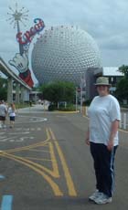 Beth posing in front of Epcot